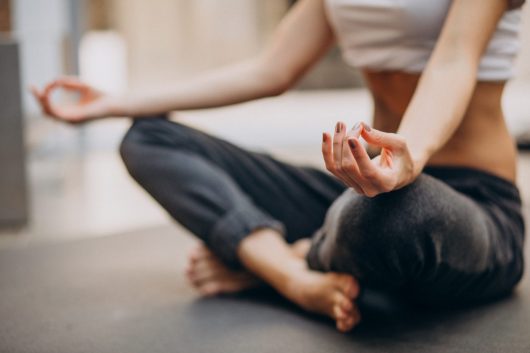 young-woman-practicing-yoga-home